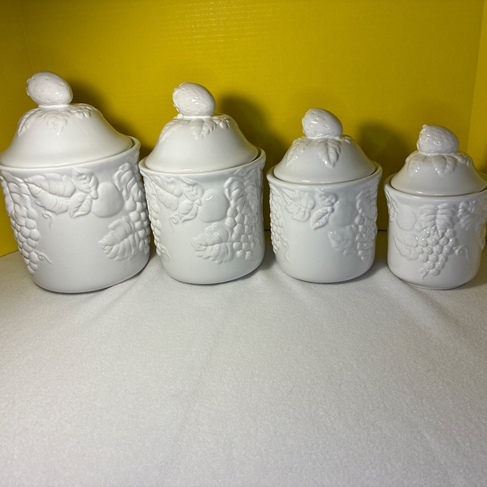 Set of  4 Vintage White Lidded Ceramic Canisters,  Grapevine and Strawberry Lid.